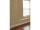 Close up of bedroom with wood floors and window with white blinds at 126 Creedmoor Rd, Stem, NC 27581