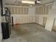 Unfinished garage interior with garage door opener and ample space for parking at 126 Creedmoor Rd, Stem, NC 27581