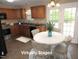 Charming kitchen features wooden cabinets and a bright breakfast nook at 126 Creedmoor Rd, Stem, NC 27581