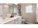 Bright bathroom featuring a double sink vanity with decorative patterned window treatments and accents at 1260 Hazelnut Ridge Ln, Knightdale, NC 27545