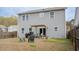 Home's backyard featuring a patio with pergola, grill, outdoor seating, and a wood privacy fence at 1620 Frog Hollow Way, Wake Forest, NC 27587