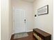 Welcoming foyer featuring wood floors, a storage bench, and inspirational wall art at 1620 Frog Hollow Way, Wake Forest, NC 27587