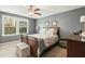 This main bedroom features ample natural light, carpet, and a ceiling fan at 1620 Frog Hollow Way, Wake Forest, NC 27587