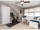 Bright exercise room with workout bike, comfortable couch and ample natural light at 1625 Heritage Garden St, Wake Forest, NC 27587