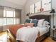 Bright bedroom with a large window, hardwood floors, and a comfortable bed at 1625 Heritage Garden St, Wake Forest, NC 27587