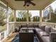 Enclosed patio with comfortable seating and a coffee table, ideal for outdoor relaxation and entertaining at 1625 Heritage Garden St, Wake Forest, NC 27587