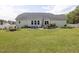 A spacious backyard with a patio and deck, perfect for outdoor gatherings and relaxation at 175 Brazil Nut Ln, Smithfield, NC 27577