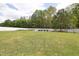 Expansive backyard featuring a lush green lawn, surrounded by a white fence; perfect for outdoor activities and relaxation at 175 Brazil Nut Ln, Smithfield, NC 27577