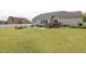 Spacious backyard featuring patio with outdoor dining and backyard deck at 175 Brazil Nut Ln, Smithfield, NC 27577