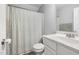 Cozy bathroom showcasing a shower with a patterned curtain and a classic white vanity at 175 Brazil Nut Ln, Smithfield, NC 27577