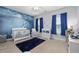 Charming Bedroom featuring a crib, blue ocean-themed mural, and ample natural light at 175 Brazil Nut Ln, Smithfield, NC 27577