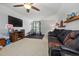 This bonus room features a large seating area, a ceiling fan, and a home gym at 175 Brazil Nut Ln, Smithfield, NC 27577