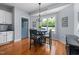Cozy breakfast nook with a chandelier, a table, and a view of the backyard, perfect for casual dining at 175 Brazil Nut Ln, Smithfield, NC 27577