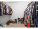 Walk-in closet features ample hanging space for clothes and shelving for shoe storage at 175 Brazil Nut Ln, Smithfield, NC 27577