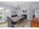 Contemporary dining area featuring wooden table with bench seating, fireplace, and modern decor at 175 Brazil Nut Ln, Smithfield, NC 27577