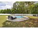 Backyard pool and lounge area with chairs and fenced in yard at 175 Brazil Nut Ln, Smithfield, NC 27577