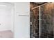 Bathroom with tiled shower, glass door, and walk-in closet at 176 Golfview Ave, Benson, NC 27504