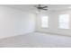 Spacious bedroom features plush carpet, natural light, and neutral paint at 176 Golfview Ave, Benson, NC 27504