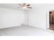 Spacious bedroom features carpet, natural light, and adjacent bathroom at 176 Golfview Ave, Benson, NC 27504