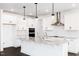 Bright kitchen features white cabinets, granite countertops, and stainless steel appliances at 176 Golfview Ave, Benson, NC 27504