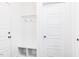 Mud room with built-in storage cubbies, hooks, and a convenient coat rack for organization at 176 Golfview Ave, Benson, NC 27504