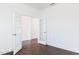 Bright, open room with pristine white walls, dark floors, and stylish French doors leading to another room at 176 Golfview Ave, Benson, NC 27504