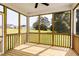 Enjoy outdoor living on this screened porch with wood floors and views of a landscaped yard at 176 Golfview Ave, Benson, NC 27504