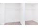 Spacious walk-in closet features built-in shelving and ample storage space with neutral walls and carpet at 176 Golfview Ave, Benson, NC 27504