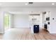 Open-concept living space with modern finishes, wood floors, and a kitchen island at 183 Little Crk Dr, Lillington, NC 27546