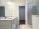 Luxurious bathroom with double vanity, marble countertop, and tiled shower at 196 Golfview Ave, Benson, NC 27504