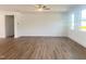 Spacious living room with hardwood flooring, ample natural light, and a ceiling fan at 196 Golfview Ave, Benson, NC 27504