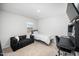 Neutral bedroom featuring a sofa and desk; the perfect space for study and relaxation at 196 River Bank Rd, Fuquay Varina, NC 27526