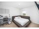 Comfortable bedroom with a large bed, work desk, and cozy decor for relaxation and focus at 196 River Bank Rd, Fuquay Varina, NC 27526