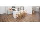 Open kitchen with a large island, seating for four, and modern appliances at 196 River Bank Rd, Fuquay Varina, NC 27526
