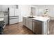 Kitchen with a large island, stainless steel dishwasher, and modern refrigerator at 196 River Bank Rd, Fuquay Varina, NC 27526