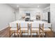 Open kitchen with a large island, seating for four, and ample counter space at 196 River Bank Rd, Fuquay Varina, NC 27526