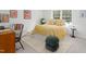 Comfortable bedroom with a cheerful bed, workspace, and natural light offering a versatile living space at 2 Banbury Ln # 2, Chapel Hill, NC 27517