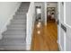 Inviting foyer with hardwood floors, staircase, and views into the adjacent rooms, creating a warm entrance at 2 Banbury Ln # 2, Chapel Hill, NC 27517