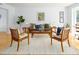 Elegant living room featuring neutral walls, wood floors and coordinated furniture creating a serene space at 2 Banbury Ln # 2, Chapel Hill, NC 27517