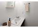Compact powder room with a stylish vanity and modern fixtures offering convenience and functionality at 2 Banbury Ln # 2, Chapel Hill, NC 27517