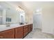 Spacious bathroom featuring double sinks, ample counter space, and modern finishes at 211 Richmond Run, Stem, NC 27581