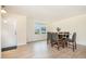 Bright dining room featuring laminate flooring, a window and a dining table with seating for six at 211 Richmond Run, Stem, NC 27581