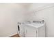 Modern laundry room equipped with a washer and dryer, and wire shelving at 211 Richmond Run, Stem, NC 27581