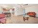 Open-concept living room with laminate flooring, leading to the kitchen and dining area at 211 Richmond Run, Stem, NC 27581