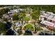 Breathtaking aerial view of a lush park surrounded by urban buildings and tree lined streets at 213 Lord Byron Ct, Cary, NC 27513
