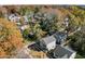 Aerial view of a neighborhood showcasing houses nestled among colorful trees and landscaping at 2207 Otis St # A, Durham, NC 27707