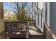 Cozy back deck with wood railings, french doors to the house, and an outdoor seating area at 2207 Otis St # A, Durham, NC 27707