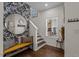 Inviting entryway with statement mirror, bench, and natural light from a window at 2207 Otis St # A, Durham, NC 27707