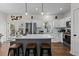 Bright kitchen featuring white cabinets, stainless steel appliances, and a central island with seating at 2207 Otis St # A, Durham, NC 27707