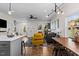 Open-concept layout with hardwood floors, modern furnishings, and plenty of natural light flowing through large windows at 2207 Otis St # A, Durham, NC 27707